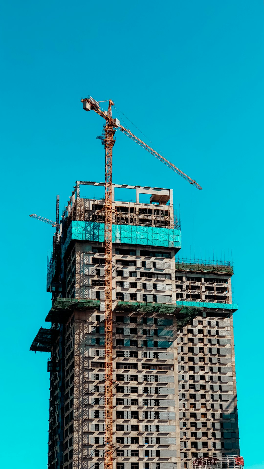 brown-and-white-concrete-building-vzacw1xs8n4